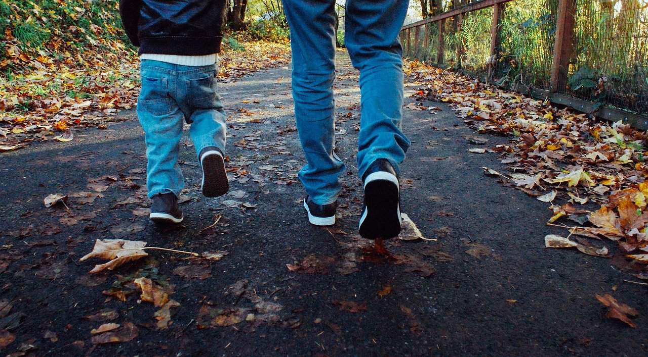 Dad and son taking a walk after reading The Book of Dad